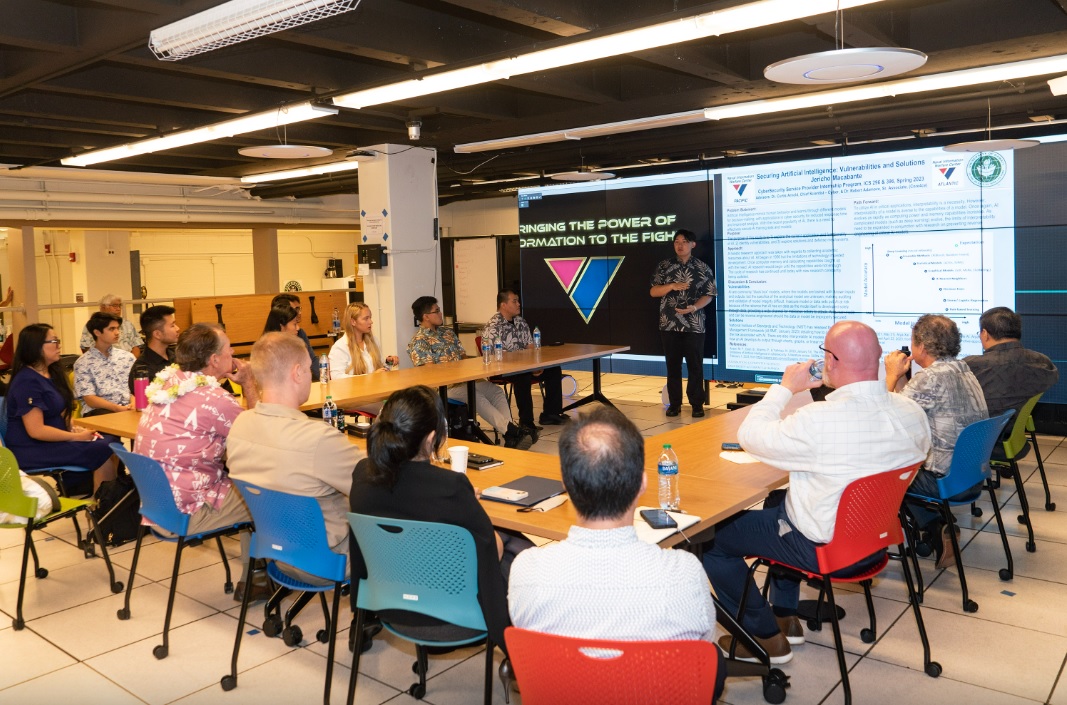 An instructor gives a presentation on bringing the power of information to the warfighter
